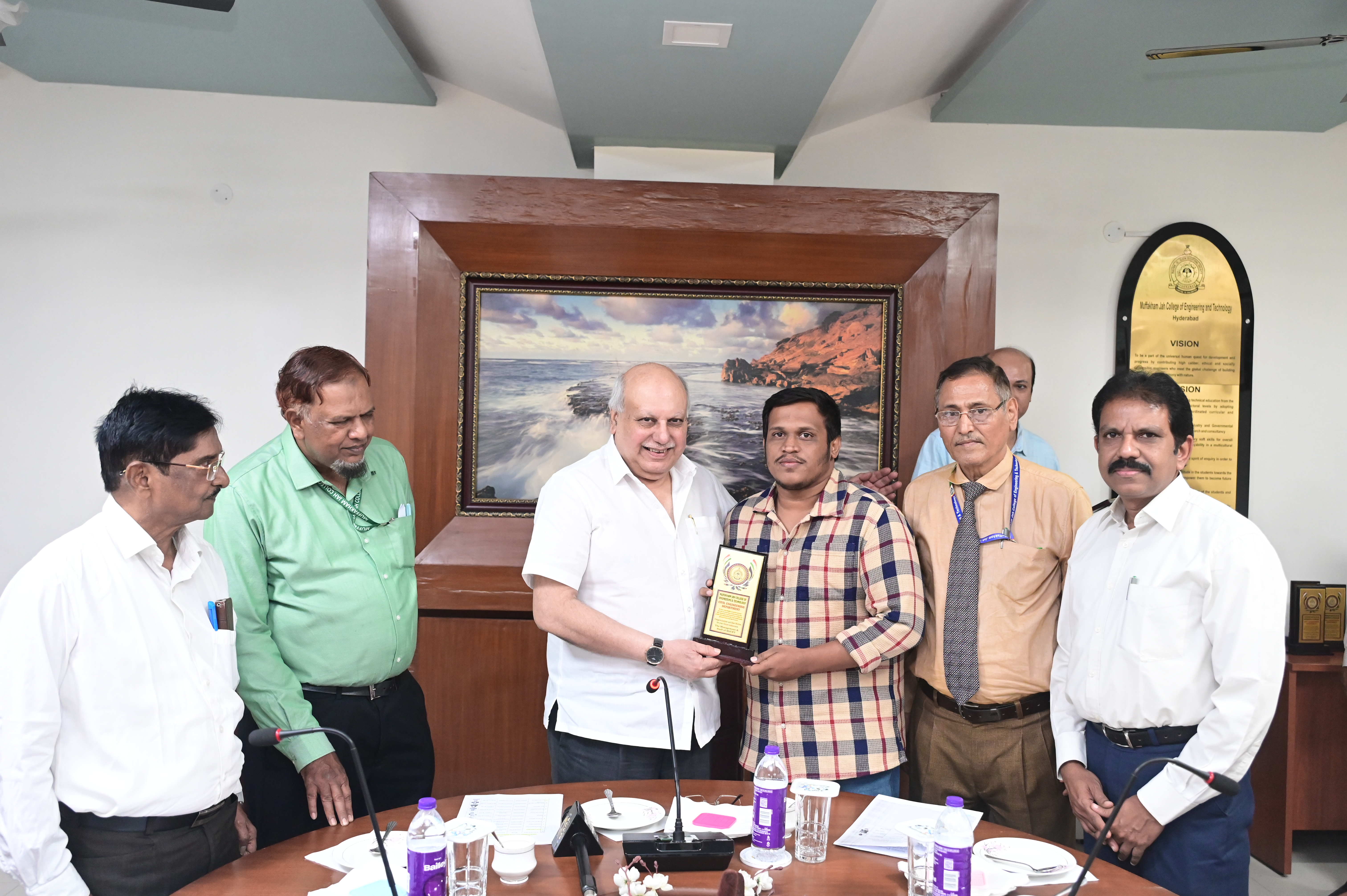 Mr. Mohd Ata Ur Rahman, TPBO receiving memento from Hon. Secretary Janab Zafar Javeed, SUES